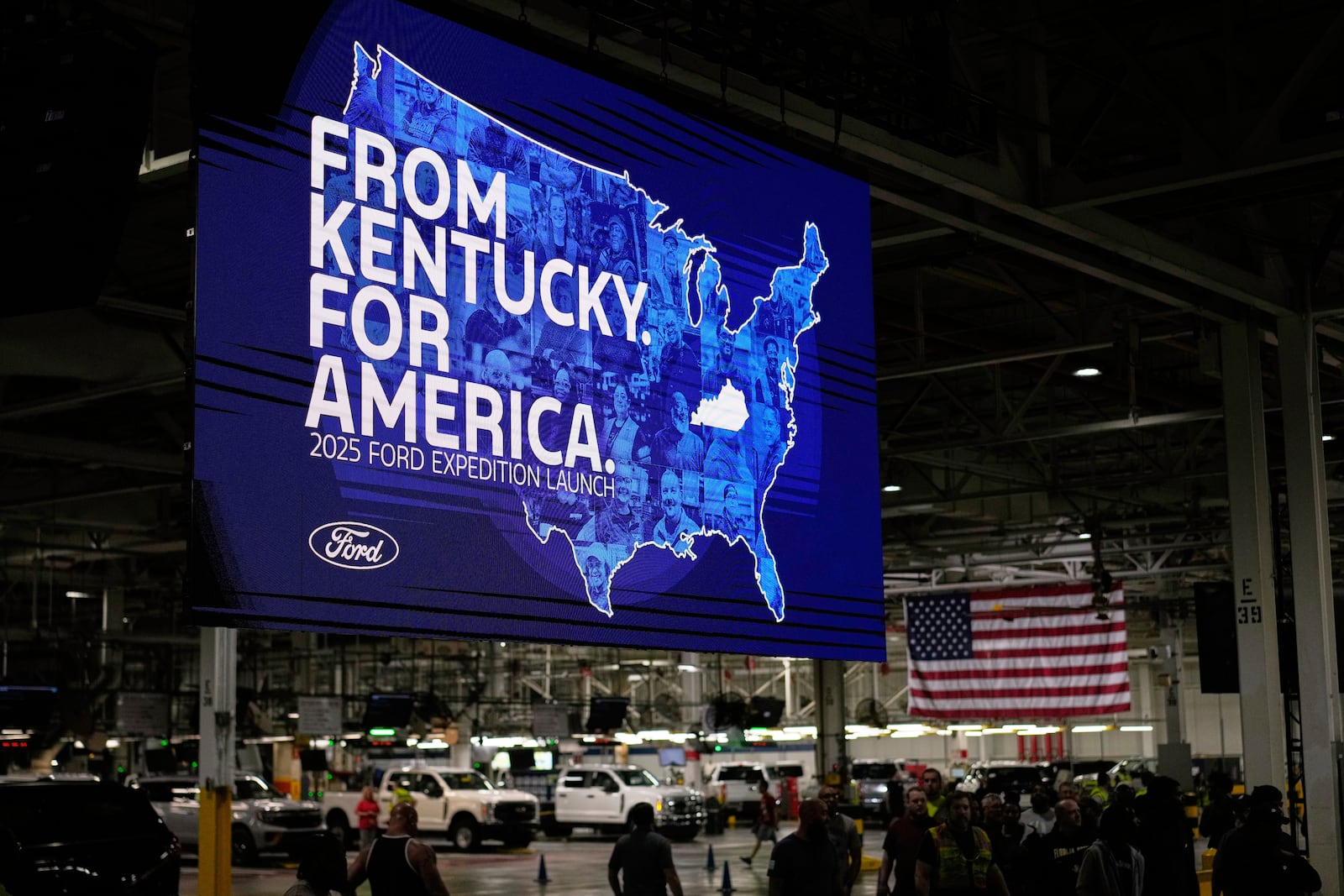 Workers gather at the Ford Motor Company Kentucky Truck Plant for the 2025 Ford Expedition launch, Wednesday, April 30, 2025, in Louisville, Ky. (AP Photo/Carolyn Kaster)