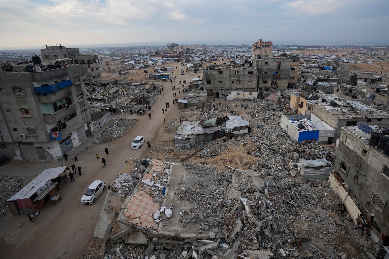 FILE - A tent camp for displaced Palestinians is set up amid destroyed buildings in the Khan Younis refugee camp, southern Gaza Strip, Jan. 4, 2025. (AP Photo/Abdel Kareem Hana, File)