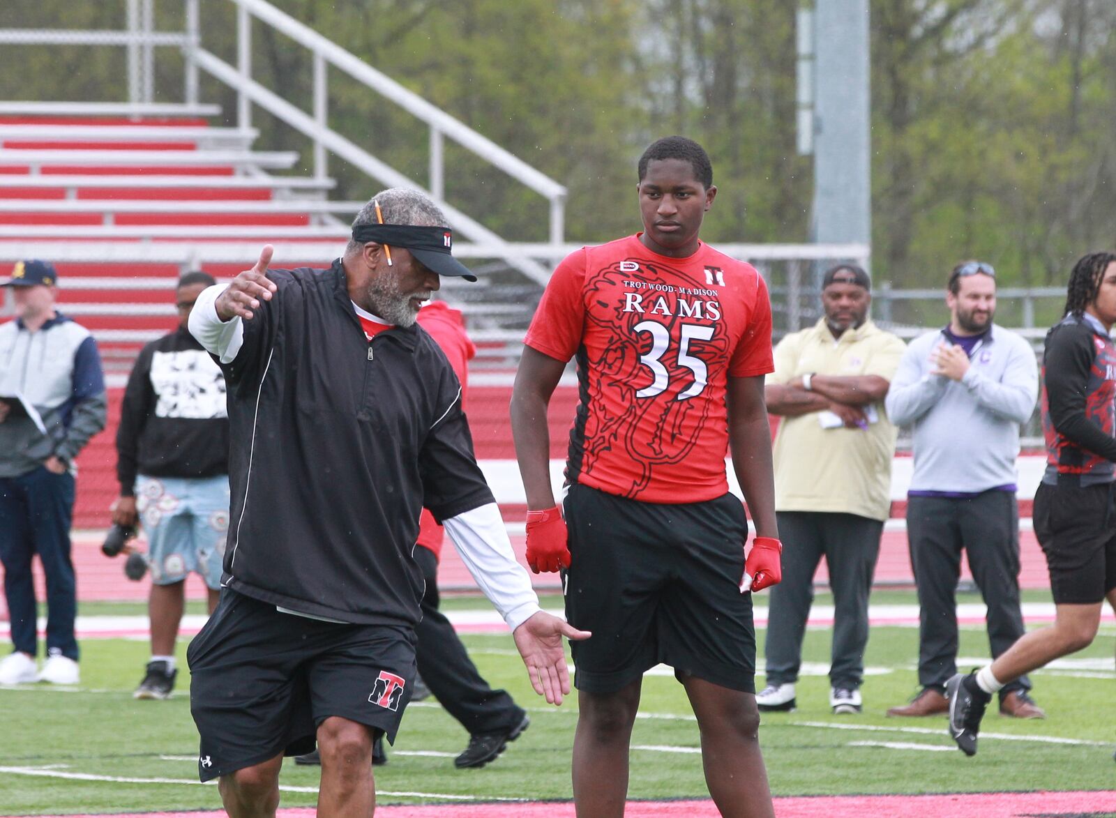 High school football recruiting showcase 2025: Trotwood-Madison coach Jeff Graham (left) and TE John Lumpkin III