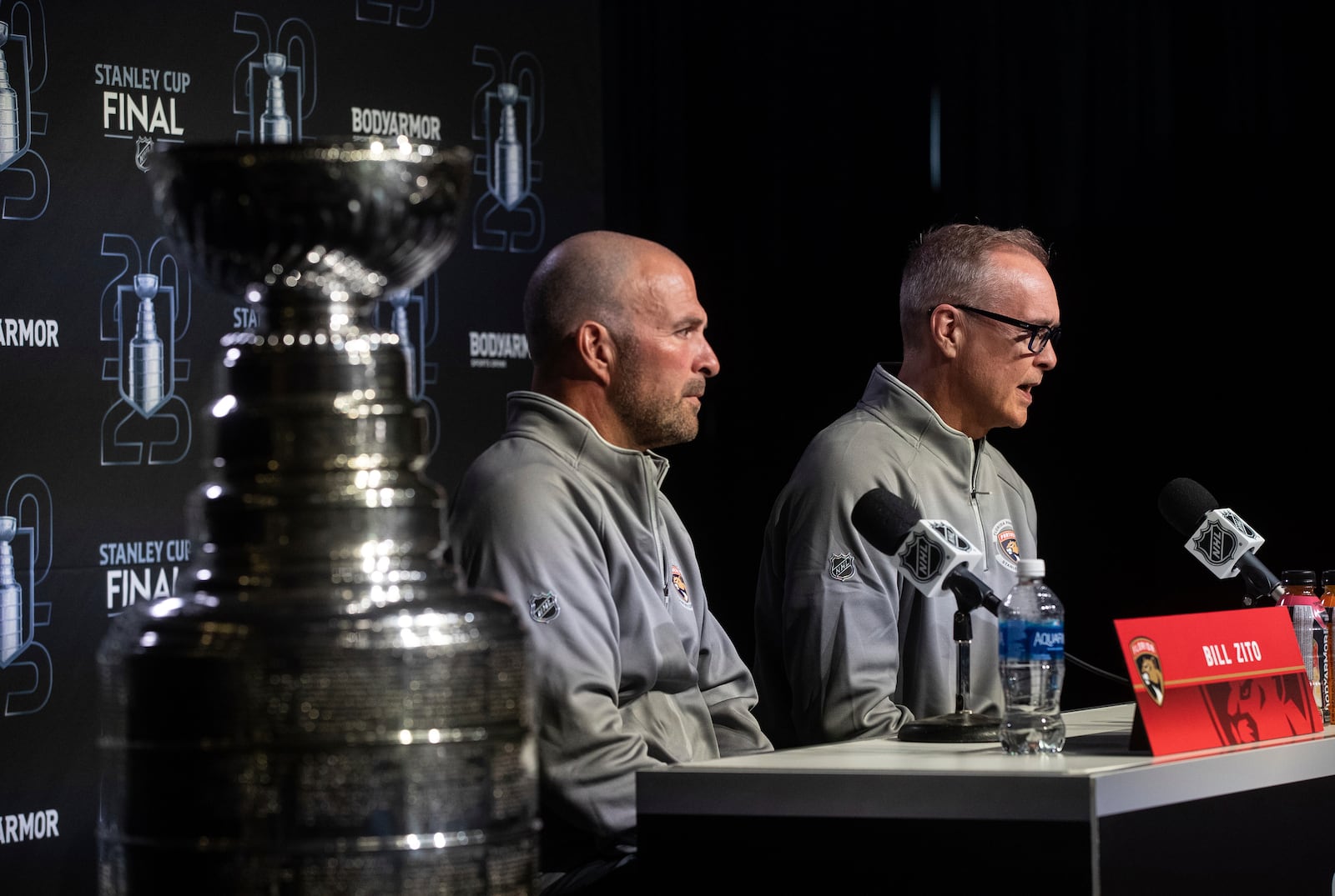 Florida Panthers' general manager Bill Zito, left, and head coach Paul Maurice speak to media during a news conference, Tuesday, June 3, 2025, in Edmonton, Alberta, ahead of Game 1 of the NHL hockey Stanley Cup final series against the Edmonton Oilers. (Jason Franson/The Canadian Press via AP)