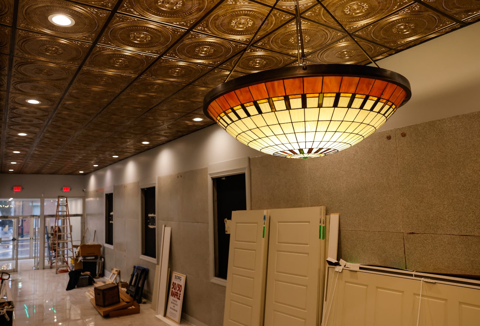Renovation and restoration continues on Sorg Opera House in Middletown. The entrance hallway is getting a makeover with new flooring, lighting and paint. NICK GRAHAM/STAFF