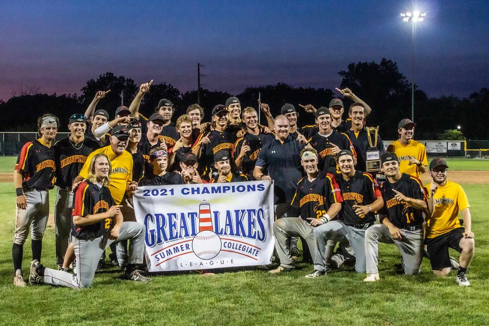 The Hamilton Joes celebrate after winning the Great Lakes Summer Collegiate League championship on Saturday. Photo by Amy DuVal-Moore