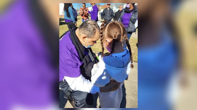 After being hospitalized for four months, Al Milton, 56, of Middletown, was welcomed home from family and friends, including his great-niece, Kamdyn Miles, 7. SUBMITTED PHOTO