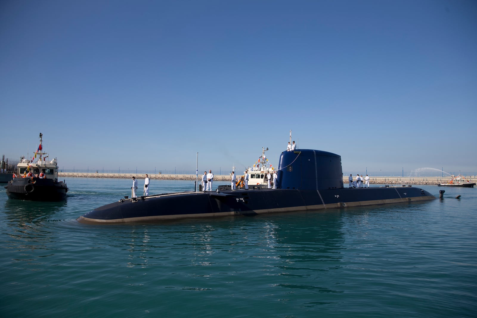 FILE - An Israeli navy sailors stand atop a submarine "Rahav" upon its arrival in to the military port in Haifa, Israel, on Jan. 12, 2016. (AP Photo/Ariel Schalit, File)
