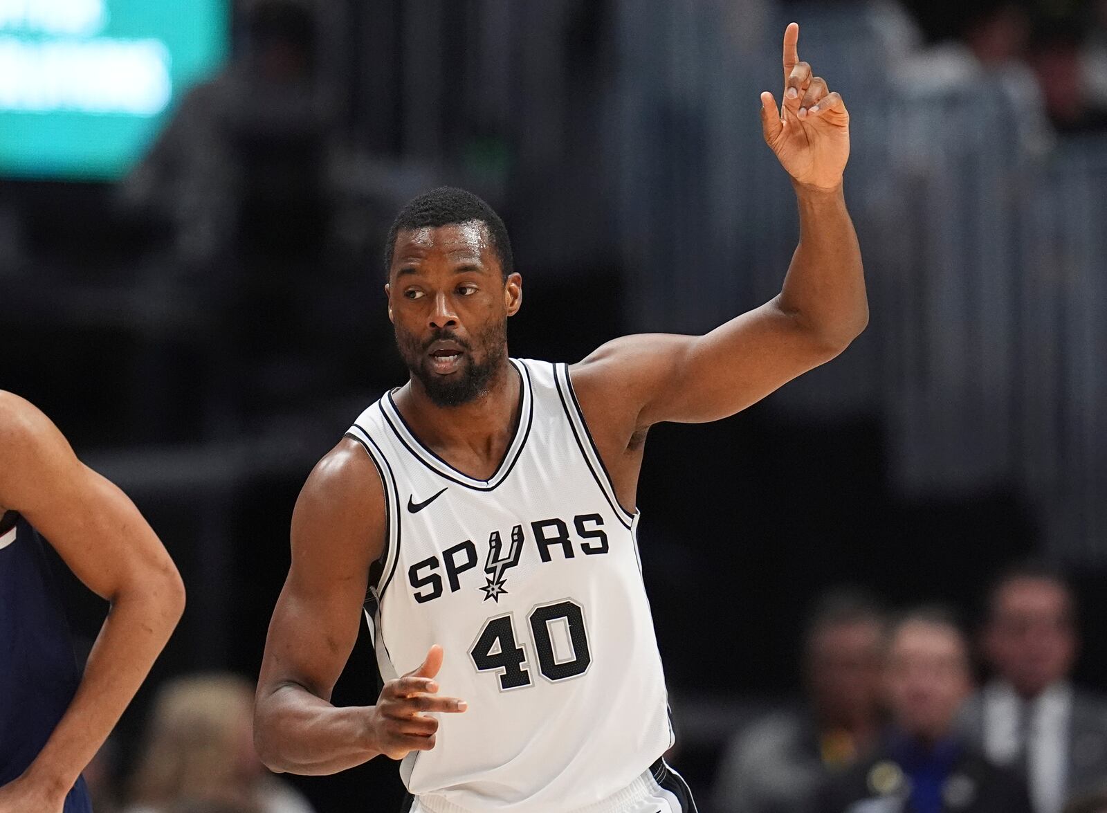 San Antonio Spurs forward Harrison Barnes gestures after hitting a 3-point shot against the Denver Nuggets in the first half of an NBA basketball game Wednesday, April 2, 2025, in Denver. (AP Photo/David Zalubowski)