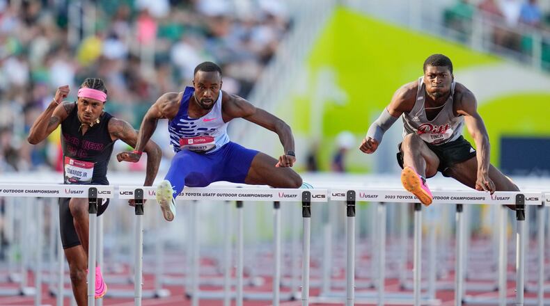 FILE - Daniel Roberts and Cordell Tinch compete in the men's 110 meter hurdles semifinal during the U.S. track and field championships in Eugene, Ore., Sunday, July 9, 2023. Left is Eric Edwards. (AP Photo/Ashley Landis, File)