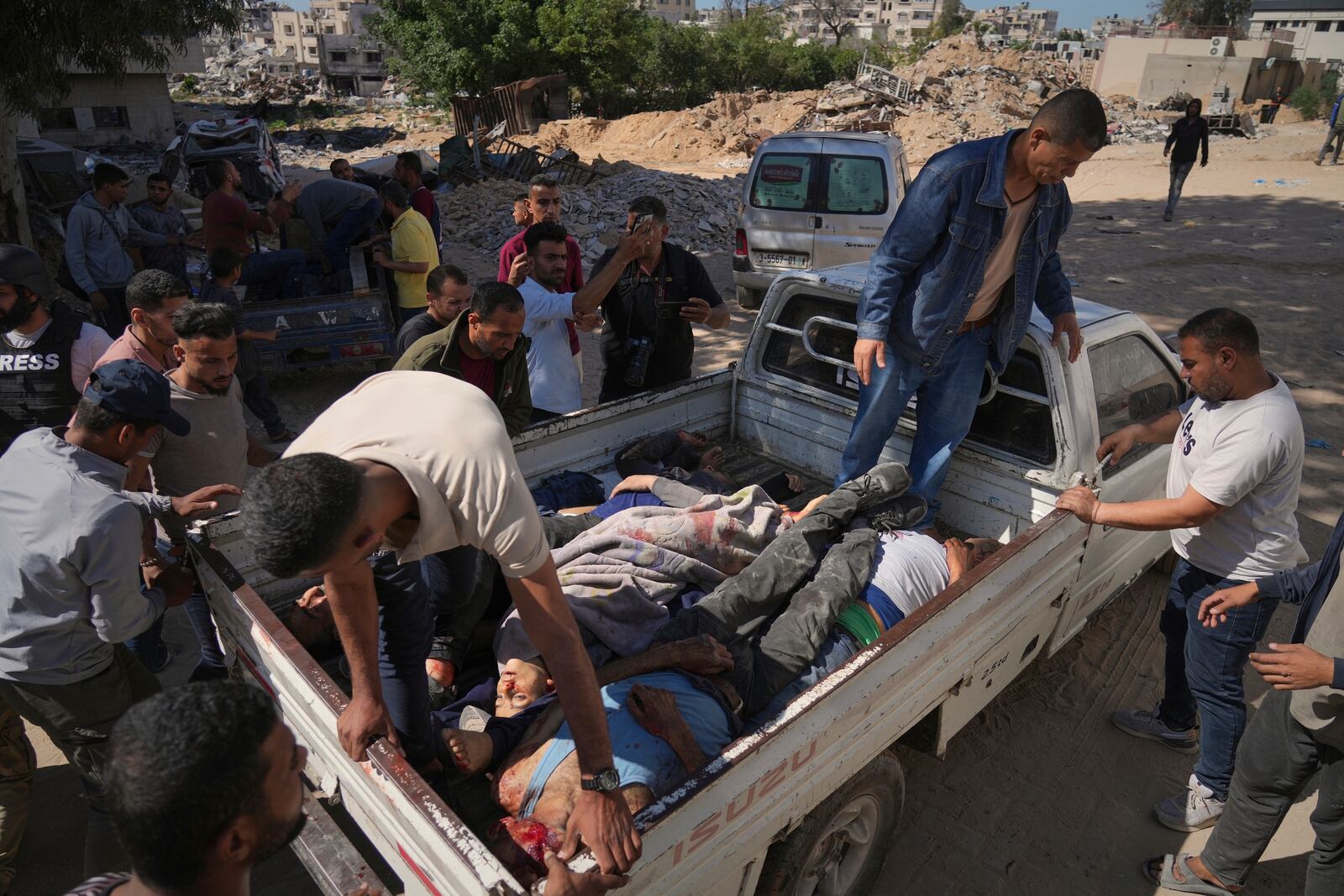 Bodies of some of the victims of an Israeli army strike on a restaurant, which killed at least 29 people, are transported from the scene to the Shifa hospital in Gaza City, Wednesday, May 7, 2025.(AP Photo/Jehad Alshrafi)