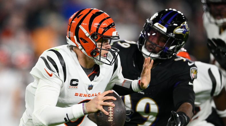 Cincinnati Bengals quarterback Joe Burrow (9) looks to pass in the first half of an NFL football game against the Baltimore Ravens in Baltimore, Thursday, Nov. 16, 2023. (AP Photo/Nick Wass)