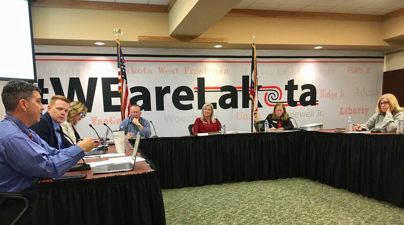 School board members said Monday they are supportive of one of two plans to restore some or all busing to grades 9-12, which was eliminated as part of sweeping budgets cuts in 2011. One plan would see busing restored to just ninth grade students starting next school year. (Photo By Michael D. Clark/Journal-News)