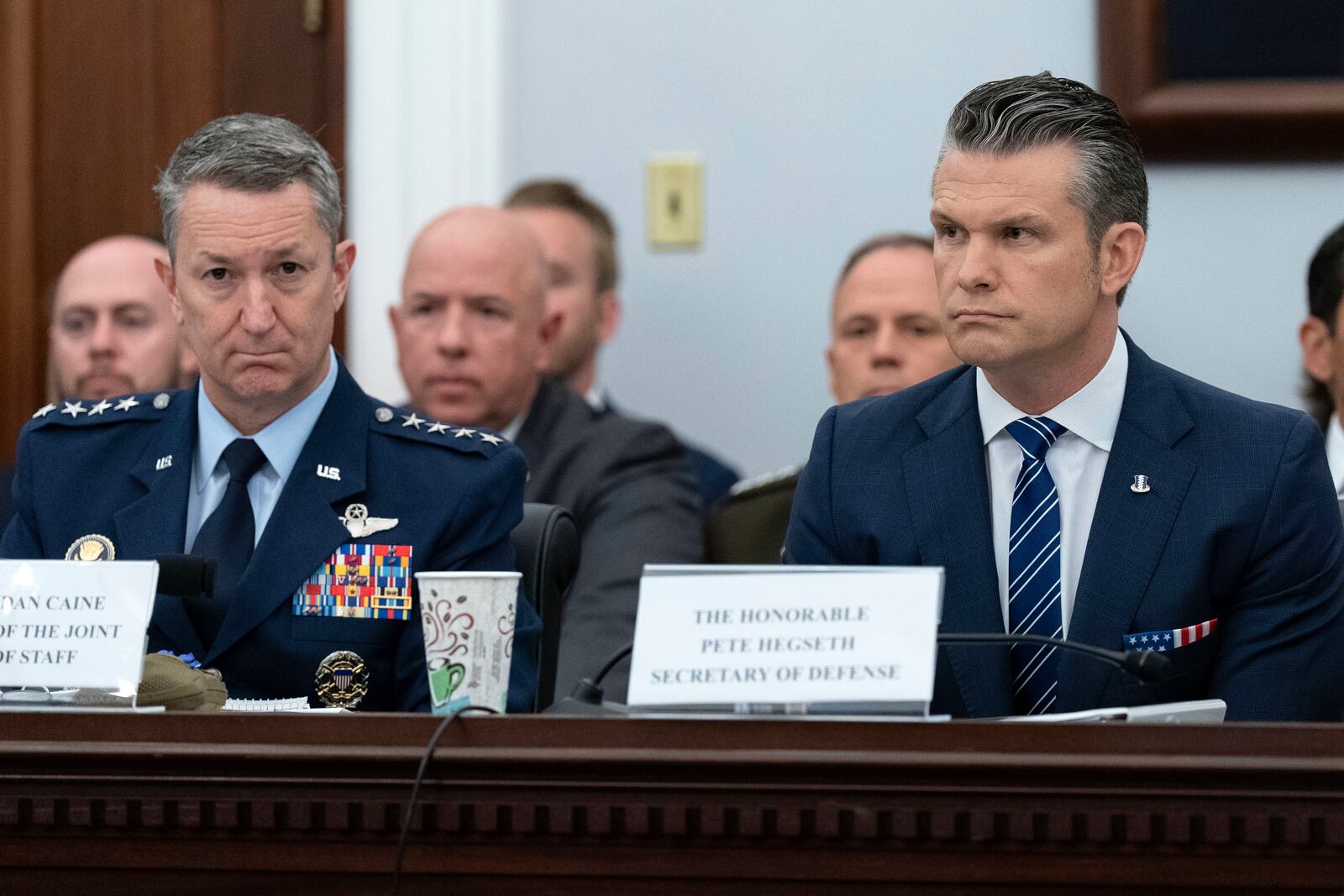The Chairman of the Joint Chiefs of Staff General Dan Caine, left, and Department of Defense Secretary Pete Hegseth testify before the House Committee on Appropriations subcommittee oversight hearing on the Department of Defense, on Capitol Hill in Washington, Tuesday, June 10, 2025. (AP Photo/Jose Luis Magana)