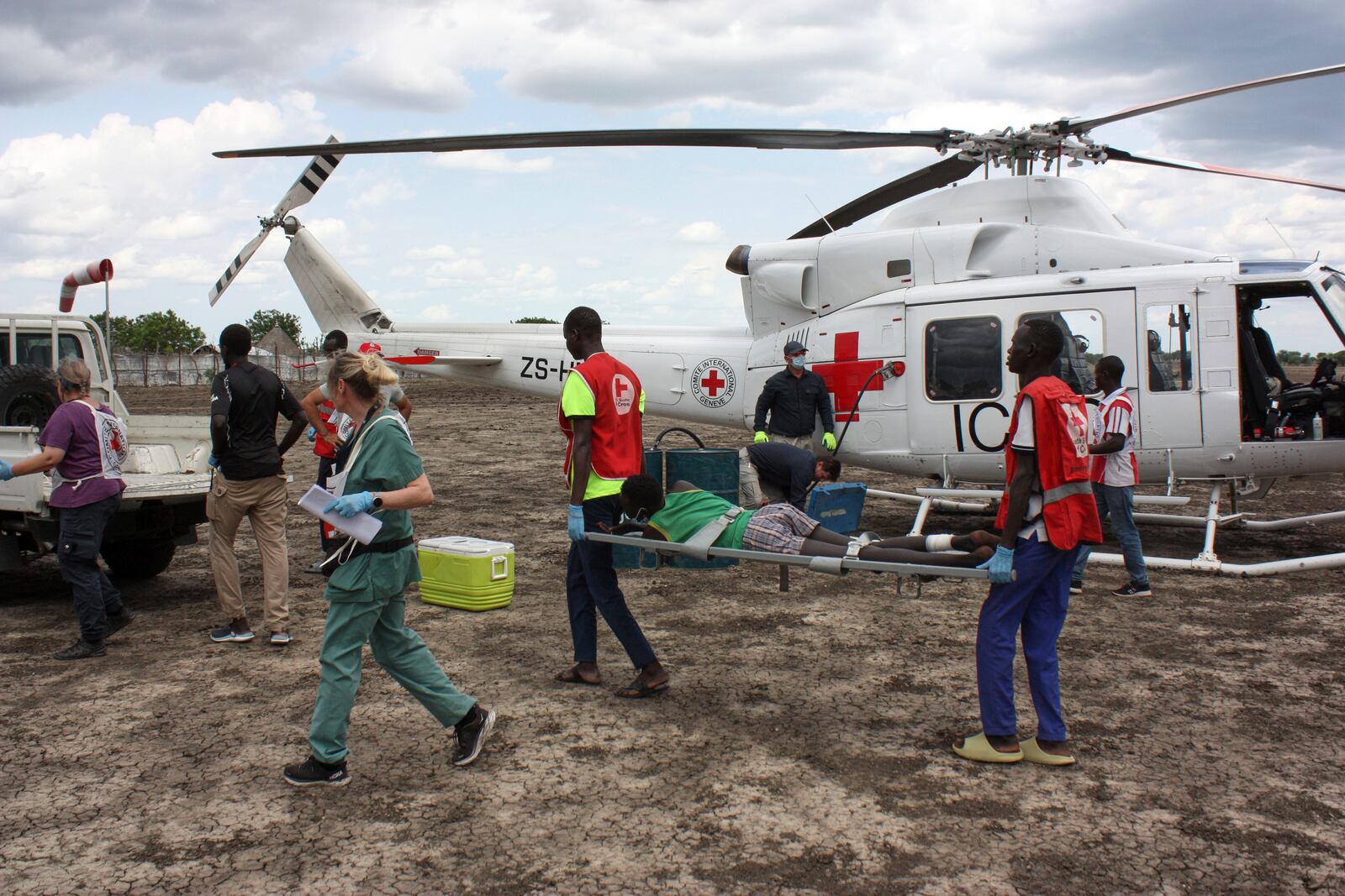 Medical staff with the International Committee of the Red Cross (ICRC) and South Sudan Red Cross, move a weapon-wounded patient to an ambulance in Akobo, South Sudan, Saturday, May 24, 2025. (AP Photo/Joseph Falzetta)