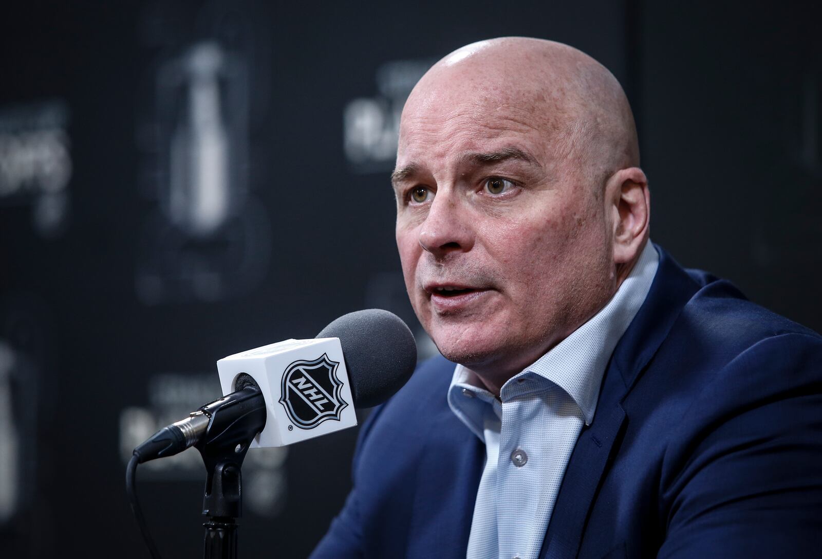St. Louis Blues head coach Jim Montgomery talks to media at a post NHL round one playoff game press conference in Winnipeg on Saturday, April 19, 2025. (John Woods/The Canadian Press via AP)