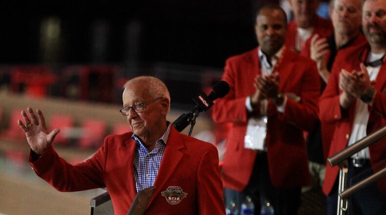 Marty Brennaman waves to fans after his induction into the Cincinnati Reds Hall of Fame on Friday, Aug. 27, 2021, at Great American BallPark in Cincinnati. David Jablonski/Staff