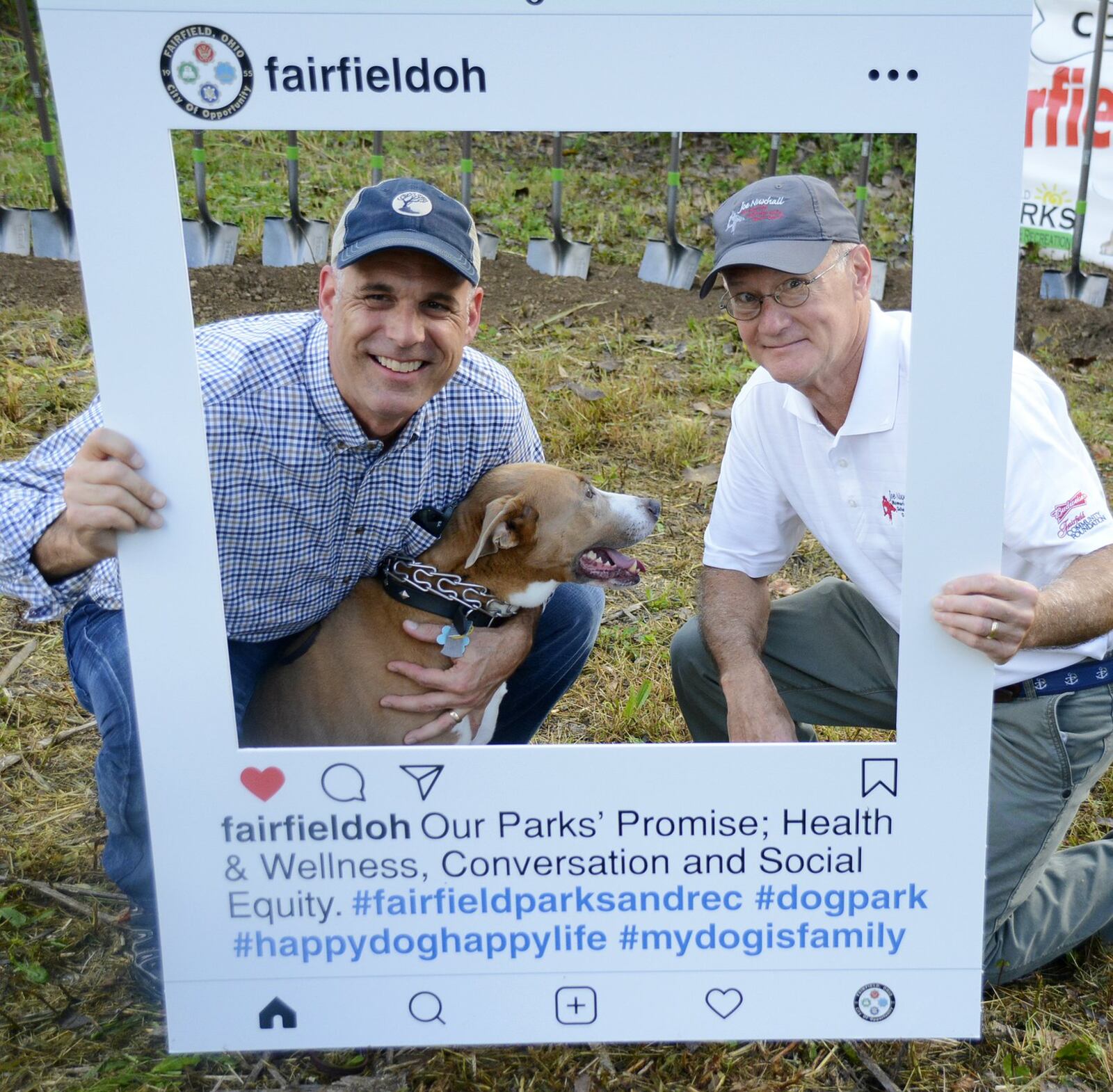 The city of Fairfield broke ground Saturday morning, Oct. 6, 2018, on its new dog park on River Road, just south of Marsh Park, on a 6.5-acre parcel. Pictured are Fairfield City Manager Mark Wendling, left, and Fairfield Law Director John Clemmons posing for a promotional Instagram cutout promoting the dog park. MICHAEL D. PITMAN/STAFF