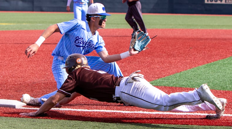 Cincinnati Christian third baseman Kael Starks waits for a throw from catcher T.J. Selvie against Heath in Friday's Division III region final loss at Wright State. Jeff Gilbert/CONTRIBUTED