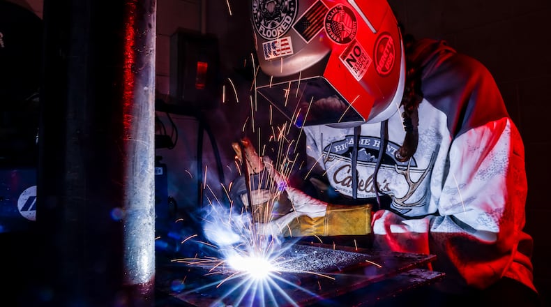 Riley Russell, 16, works on a project in the welding program at Butler Tech Wednesday, Oct. 18, 2023 in Fairfield Township. NICK GRAHAM/STAFF