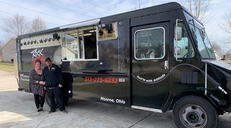 Kelli and Michael Williams, of Monroe, stand next to Rock N Rolls Food Truck. The new business launched March 14 and has since visited several locations in Fairfield and West Chester Twp. while looking for more places to serve. CONTRIBUTED