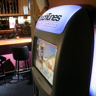 A TouchTunes digital jukebox is seen on the wall of a bar near Middletown. FILE PHOTO