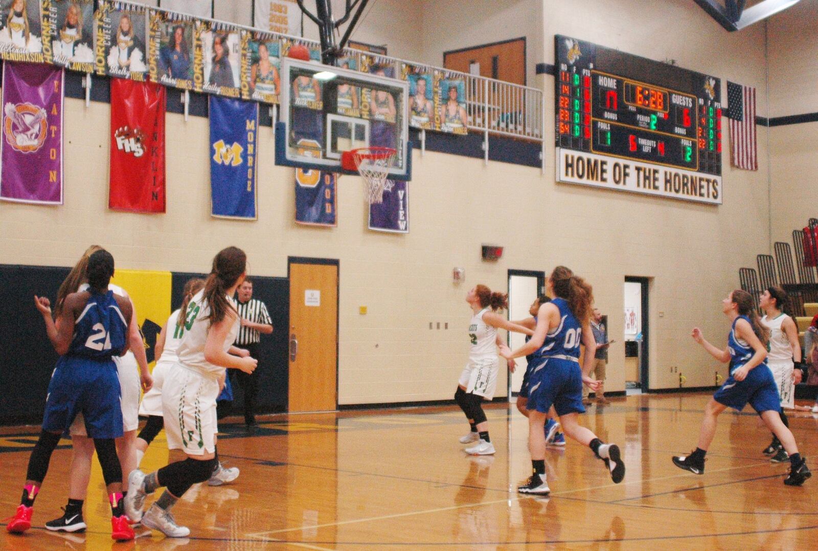 Everybody’s waiting for the ball to come down after a 3-point attempt by Middletown Christian’s Trinity Bellard (21) during Wednesday night’s Division IV sectional game against Fayetteville-Perry at Monroe. Fayetteville won 55-13. RICK CASSANO/STAFF