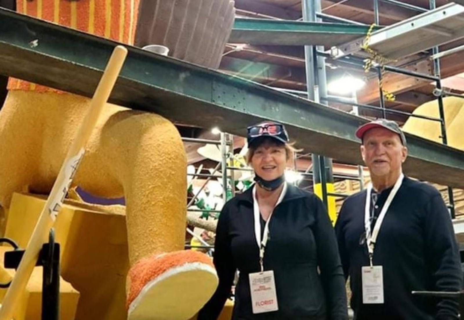 Michael Brown and Sandra Simpson, floral designers at Flowers by Roger in Middletown, are volunteering this week in California to bring the Tournament of Rose Parade floats to life. MICHAEL BROWN/SUBMITTED