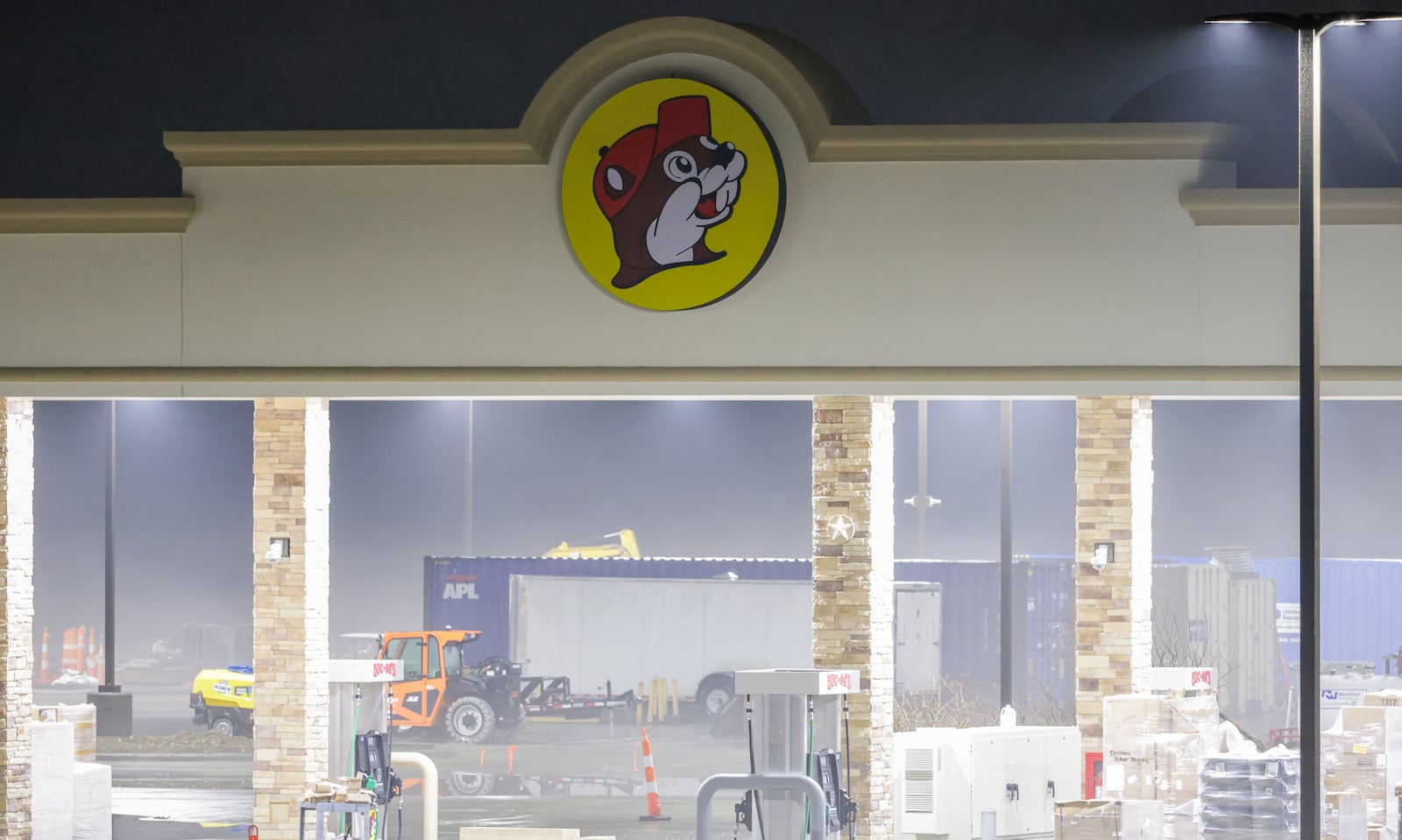 Construction of the Buc-ee's in Huber Heights near the Interstate 70 and Ohio 235 interchange is nearly complete. Lights on the superstation, which is scheduled to open to the public on April 6, are on a nighttime, including in foggy conditions in the early morning hours on Thursday, March 5. BRYANT BILLING / STAFF