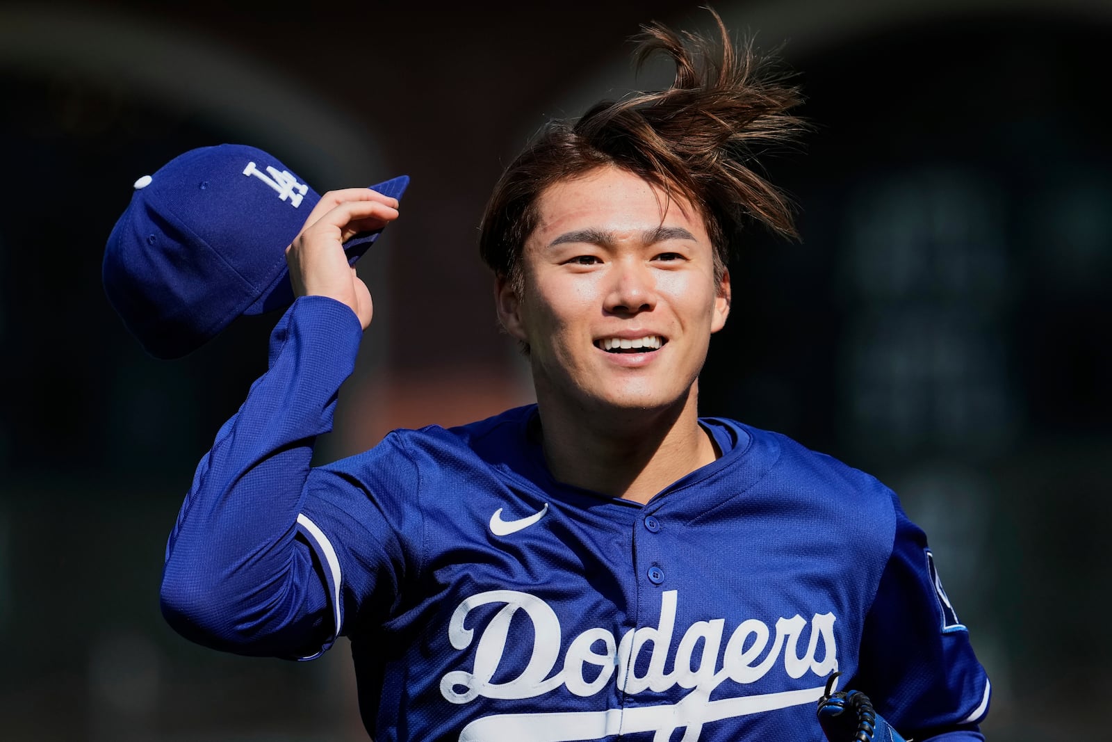 Los Angeles Dodgers' Yoshinobu Yamamoto walks to the dugout before a baseball game against the San Francisco Giants, Friday, July 11, 2025, in San Francisco. (AP Photo/Godofredo A. Vásquez)