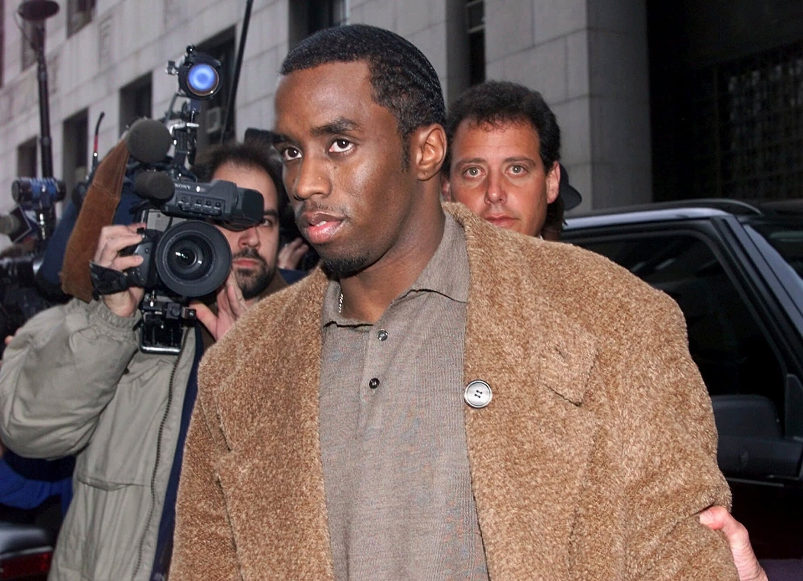 FILE - Rapper Sean "Puffy" Combs arrives at the Manhattan District Attorney's office in New York, on Jan. 4, 2000, where Combs and his girlfriend Jennifer Lopez were to appear before a grand jury investigating the Times Square nightclub shooting that left three people injured in late Dec. 1999. (AP Photo/Kathy Willens, File)