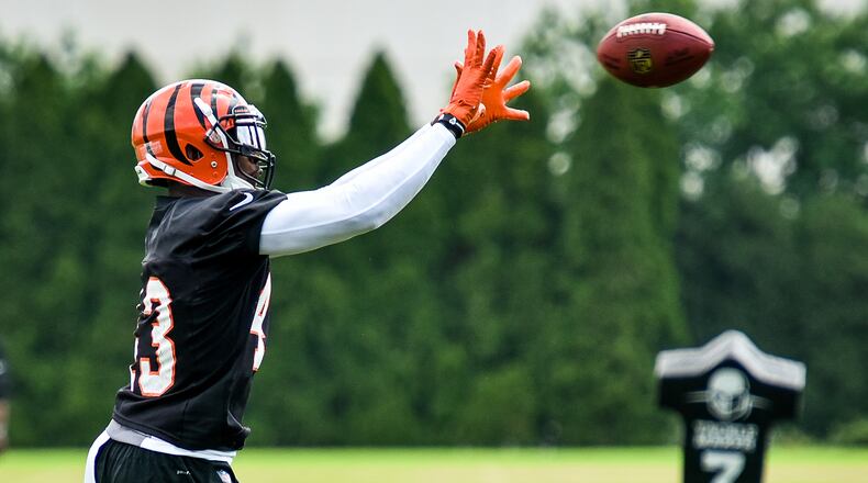 Bengals’ George Iloka catches a pass during organized team activities Tuesday, May 22 at the practice facility near Paul Brown Stadium in Cincinnati. NICK GRAHAM/STAFF