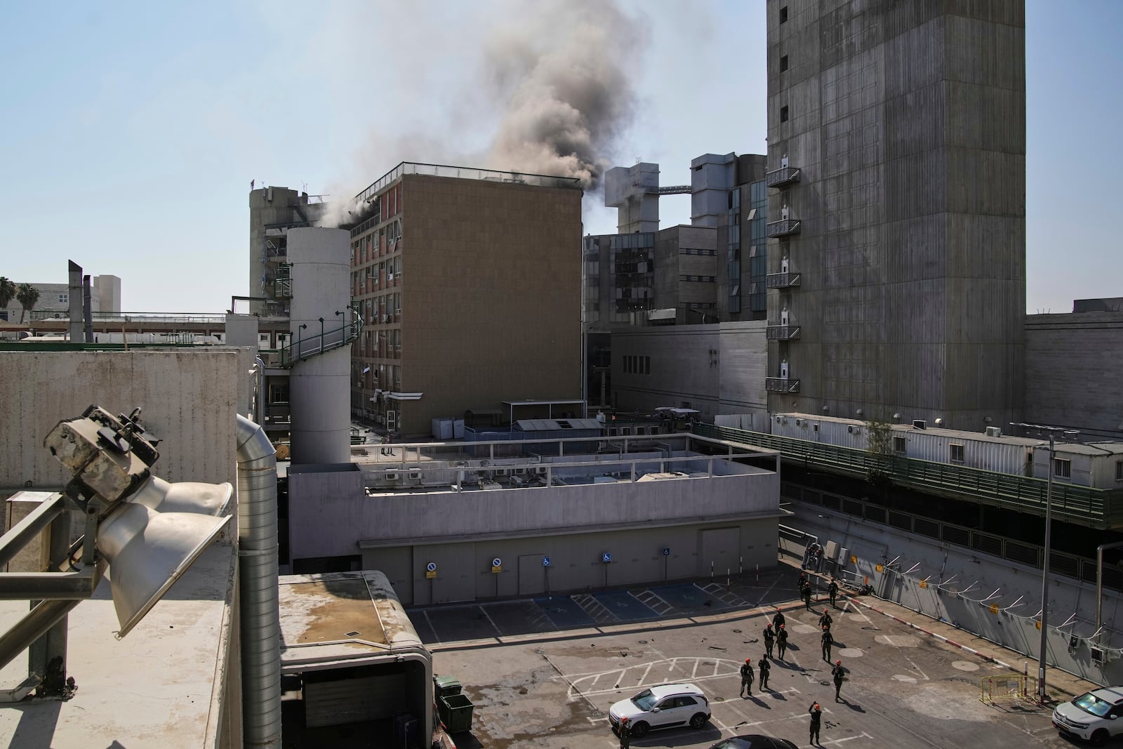 Smokes raises from a building of the Soroka hospital complex after it was hit by a missile fired from Iran in Be'er Sheva, Israel, Thursday, June 19, 2025. (AP Photo/Leo Correa)