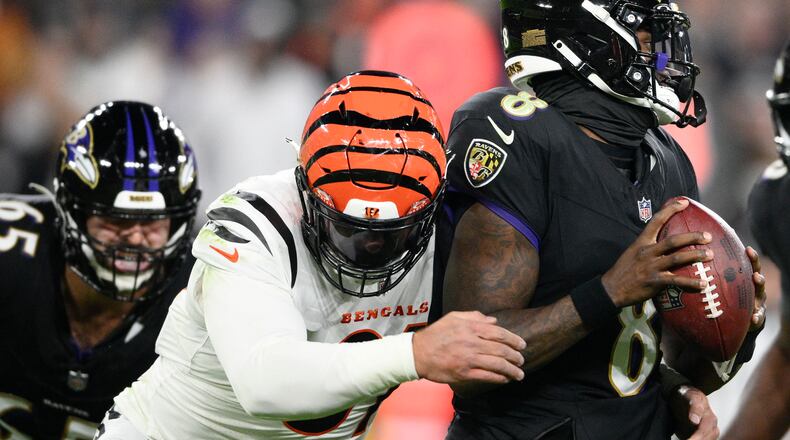 Cincinnati Bengals defensive end Trey Hendrickson (91) sacks Baltimore Ravens quarterback Lamar Jackson (8) in the first half of an NFL football game in Baltimore, Thursday, Nov. 16, 2023. (AP Photo/Nick Wass)