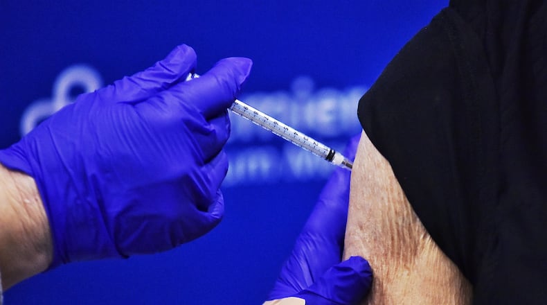 Atrium Medical Center administered some of their first phase 1B covid vaccines to qualified participants Tuesday, January 19, 2021 in Middletown. Premier Health has 1100 vaccines network wide and 100 for Atrium Medical Center for this community vaccine clinic. Pfizer vaccines were given to 5 people during this media event. NICK GRAHAM / STAFF