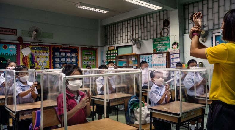 FILE -- Students at Sawasdee Wittaya Primary School learn about washing hands in their first class back at school during the pandemic, in Bangkok, July 1, 2020. Thailand has recorded only 58 deaths due to the coronavirus, and local transmission has ceased. There are many contributing factors, but no one knows for certain why the country has been spared. (Adam Dean/The New York Times)