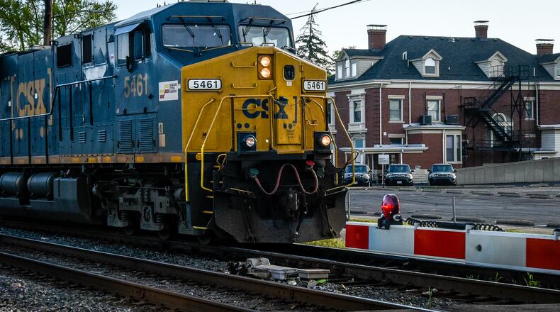 A CSX train rolls down the tracks along N 5th Street at the Butler Street crossing in Hamilton Friday, April 21. NICK GRAHAM/STAFF