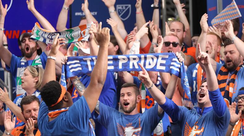 Fans cheer at a press conference where it was announced FC Cincinnati will join Major League Soccer at Rhinegeist Brewery on Tuesday, May 29, 2018, in Cincinnati. David Jablonski/Staff