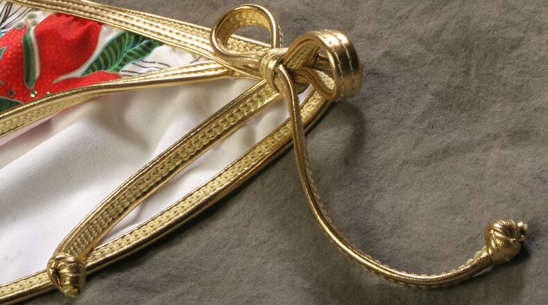 A bikini-clad woman was taken into custody this morning after an alleged theft in Hamilton, according to police.