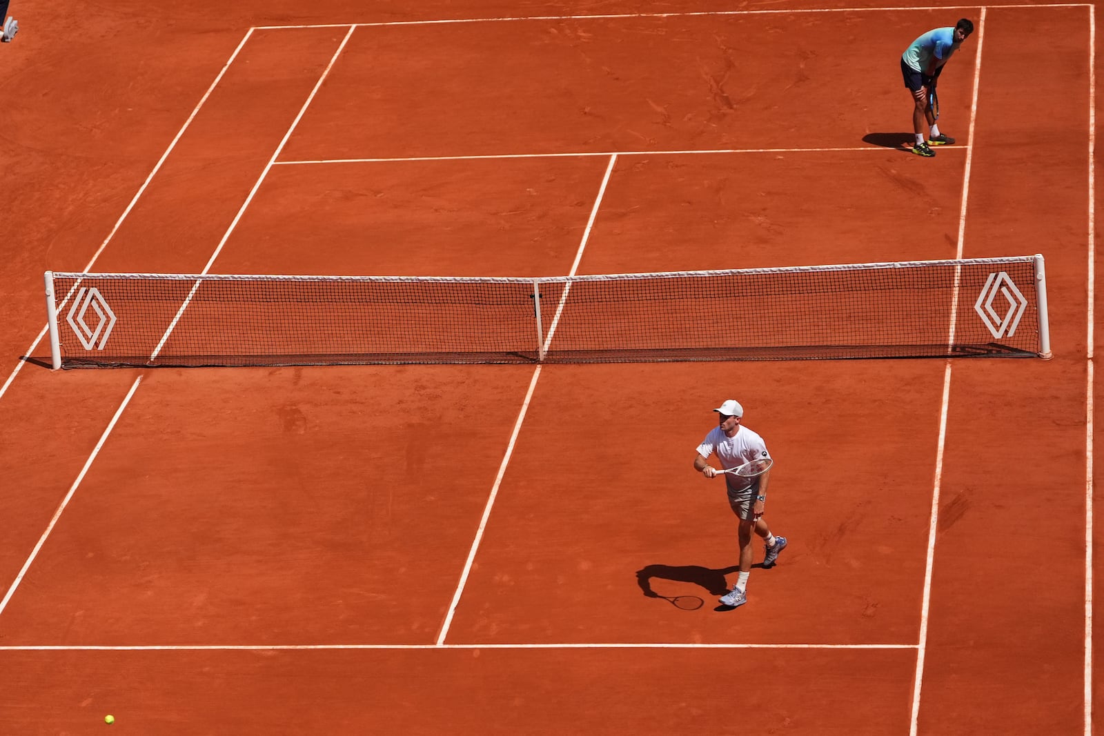 Tommy Paul of the U.S. reacts winning a point to Australia's Alexei Popyrin, top right, during their fourth round match of the French Tennis Open, at the Roland-Garros stadium, in Paris, Sunday, June 1 2025. (AP Photo/Lindsey Wasson)