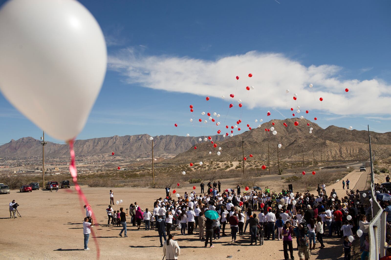 FILE— Balloons representing the hopes and struggle of immigrant communities are released during an event organized by the Border Network for Human Rights organization along the border fence on the outskirts of Ciudad Juarez, Mexico, Feb. 15, 2016. (AP Photo/Ivan Pierre Aguirre, File)