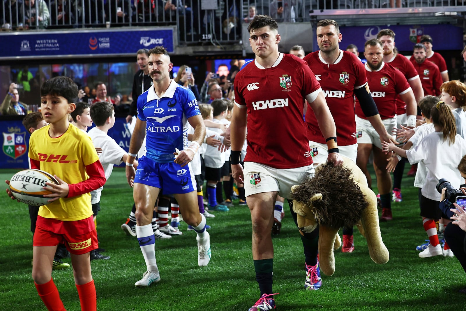 Dan Sheehan of the British & Irish Lions leads his team onto the field for their rugby match against the Western Force in Perth, Australia, Saturday, June 28, 2025. (AP Photo/Trevor Collens)