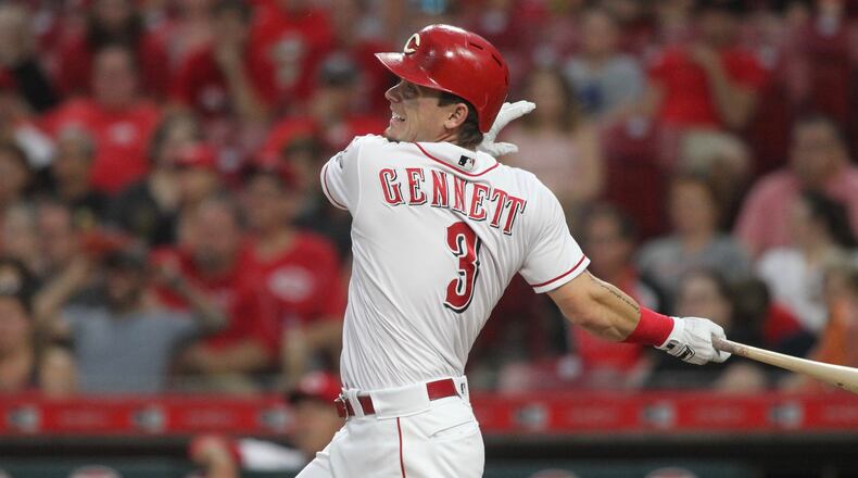 The Reds Scooter Gennett drives in a run with a double against the Pirates on Tuesday, May 22, 2018, at Great American Ball Park in Cincinnati. David Jablonski/Staff