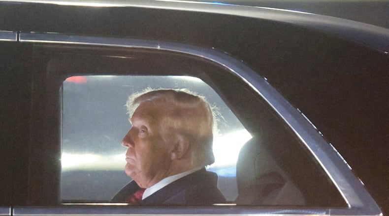 President Donald Trump is seen in his limousine, known as "The Beast," upon his arrival at Joint Base Andrews, Md., Wednesday, Nov. 5, 2025, after giving a speech at the American Business Forum in Miami. (AP Photo/Luis M. Alvarez)