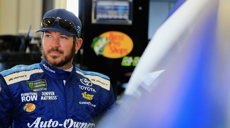 SPARTA, KY - JULY 13: Martin Truex Jr., driver of the #78 Auto-Owners Insurance Toyota, stands in the garage area during practice for the Monster Energy NASCAR Cup Series Quaker State 400 presented by Walmart at Kentucky Speedway on July 13, 2018 in Sparta, Kentucky. (Photo by Daniel Shirey/Getty Images)