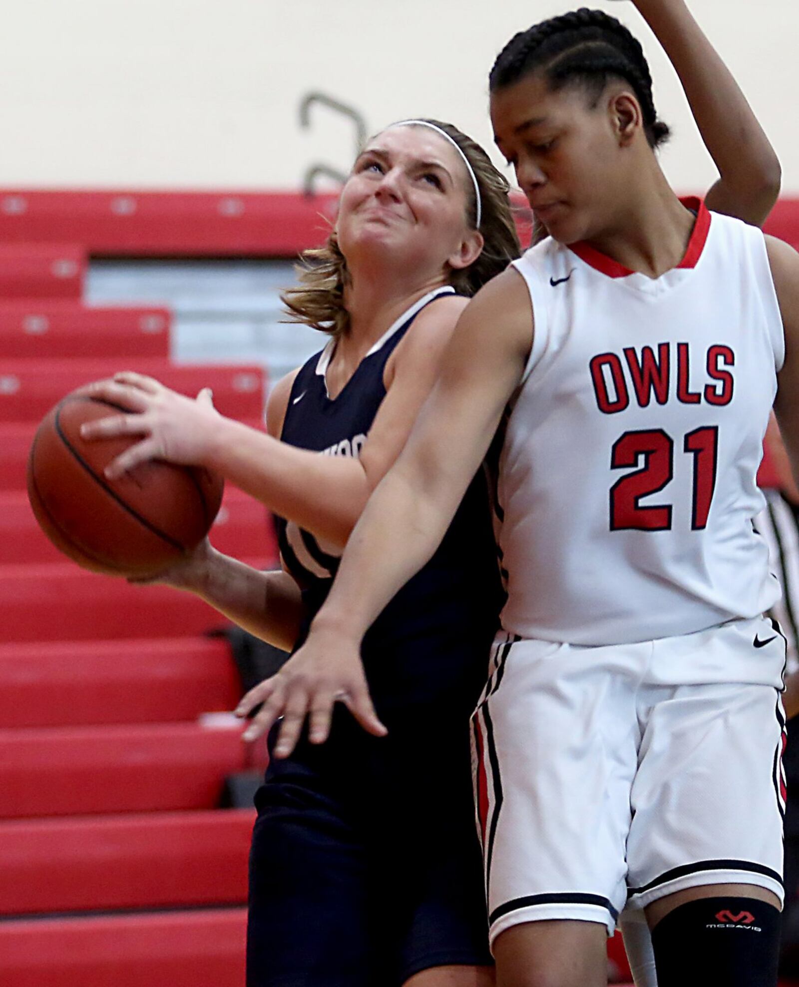Edgewood forward Kayla Curtis is blocked by Mt. Healthy’s Kimara Richard on Saturday afternoon at Mt. Healthy. CONTRIBUTED PHOTO BY E.L. HUBBARD