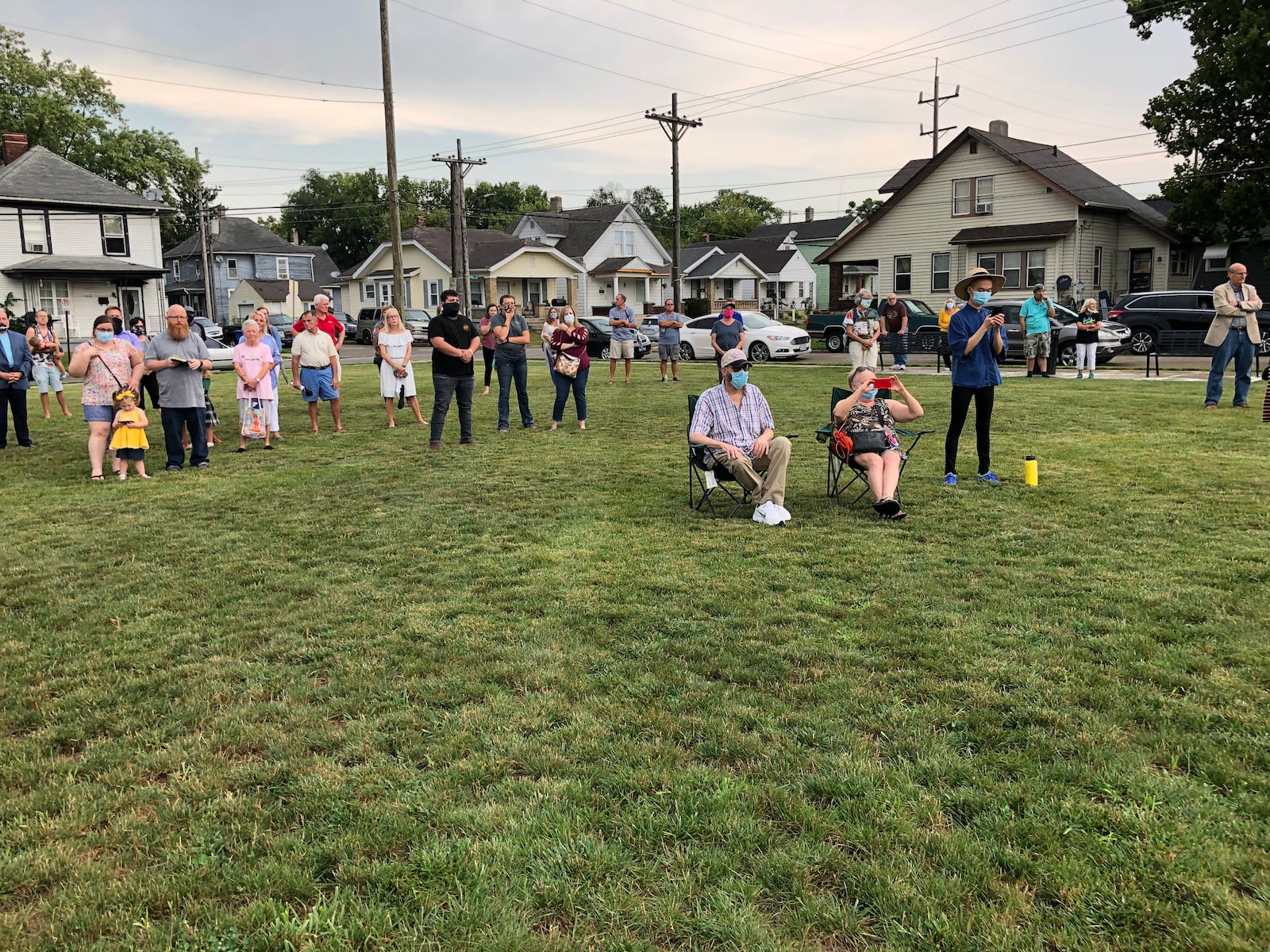 Residents of the Jefferson neighborhood gathered Tuesday to dedicate the new mural, Garden Parade, in the two-year-old Jefferson Park. MIKE RUTLEDGE/STAFF