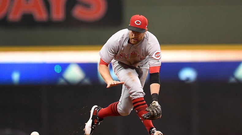 MILWAUKEE, WI - SEPTEMBER 26: Zack Cozart #2 of the Cincinnati Reds fields a ground ball during the seventh inning of a game against the Milwaukee Brewers at Miller Park on September 26, 2017 in Milwaukee, Wisconsin. (Photo by Stacy Revere/Getty Images)
