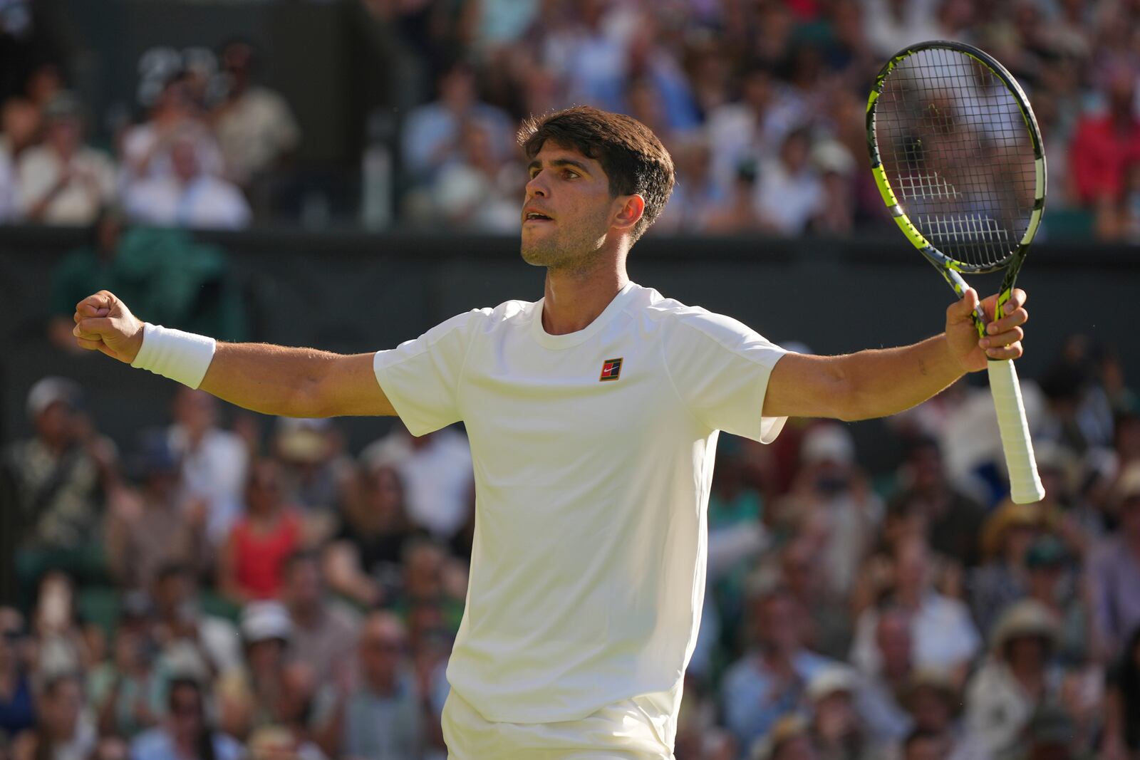 Carlos Alcaraz of Spain celebrates after beating Fabio Fognini of Italy during their first round men's singles match at the Wimbledon Tennis Championships in London, Monday, June 30, 2025. (AP Photo/Alastair Grant)