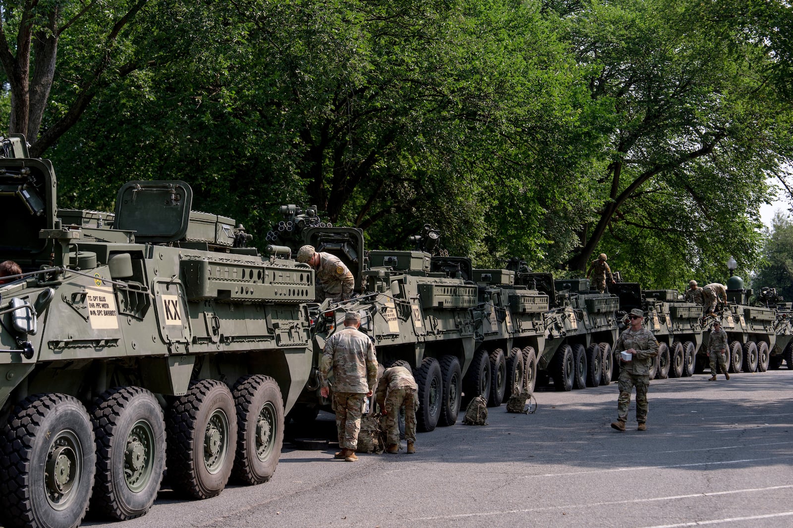 U.S. Army soldiers work on Stryker combat vehicles staged in West Potomac Park ahead of an upcoming military parade commemorating the Army's 250th anniversary and coinciding with Donald Trump's 79th birthday, Wednesday, June 11, 2025, in Washington (AP Photo/Julia Demaree Nikhinson)