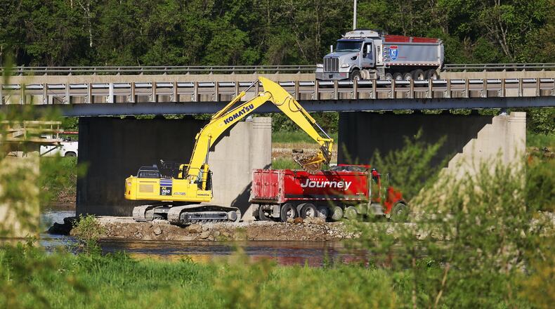 Workers are preparing the Ohio 122 bridge over the Great Miami River for construction set to begin Monday. The bridge that connects Middletown to Madison Twp. will be closed for 45 days, according to the Ohio Department of Transportation. NICK GRAHAM/STAFF