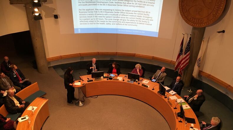 Middletown City Council Tuesday listens to a presentation from Planning Director Ashley Combs concerning the request to rezone two parcels for Kettering Health Network’s Middletown facility. Kettering Health Networks is seeking the zoning change that will enable them to have inpatient beds for their patients. Premier Health, operator of Atrium Medical Center, opposes the request citing duplication of services with the additional beds and that it will increase healthcare costs in the area. ED RICHTER/STAFF