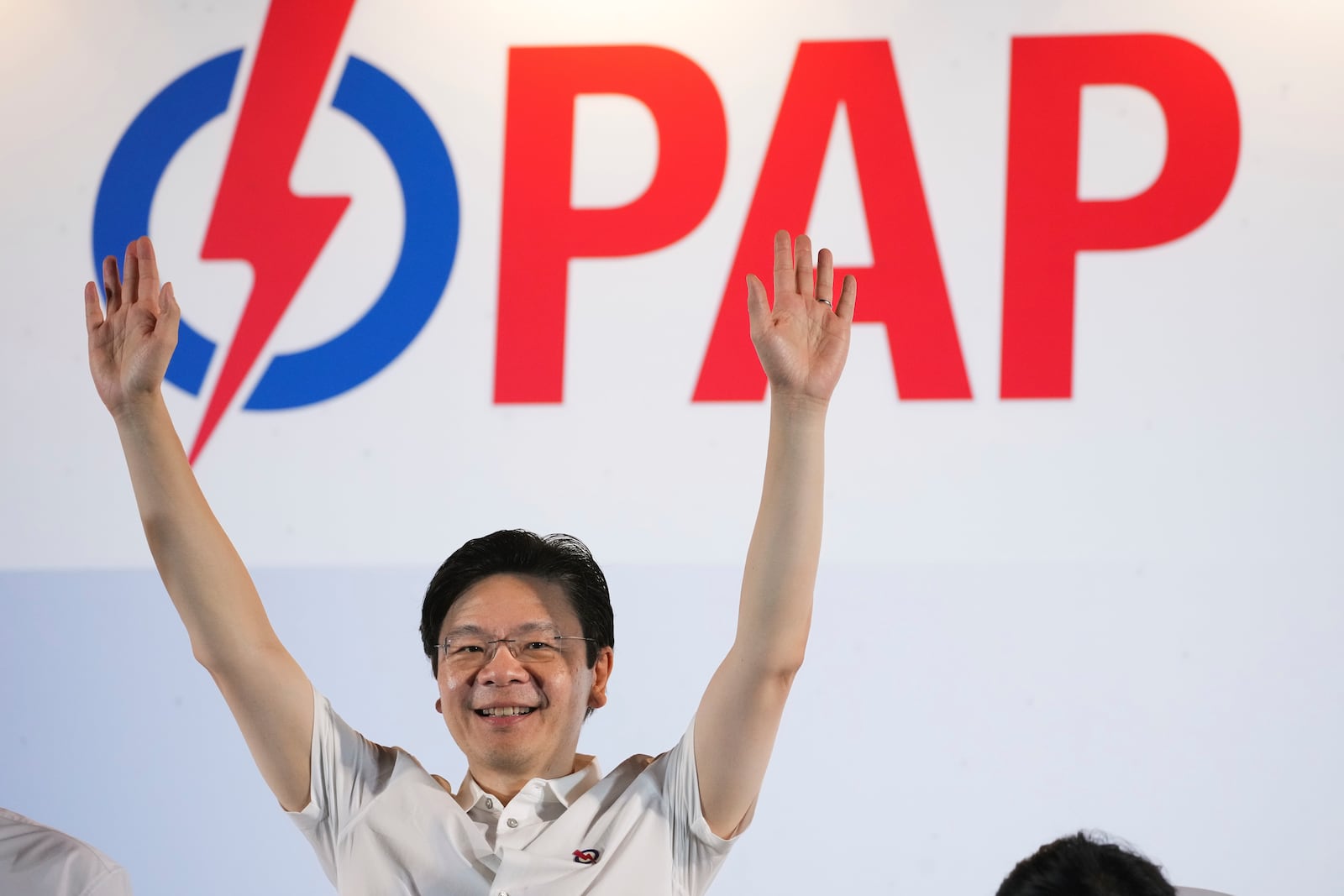 Prime Minister Lawrence Wong's, from People's Action Party (PAP) thanks his supporters and voters at an assembly area for People's Action Party supporters, on the day of the general election in Singapore, Saturday, May 3, 2025. (AP Photo/Vincent Thian)