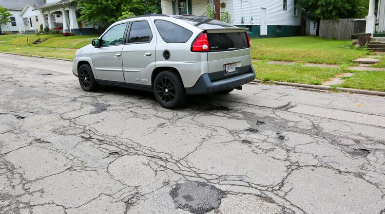 Middletown City Council has said road paving is among the top priorities for the 2018 city budget. Middletown City Council will consider raising the city’s income tax by 0.25 percent for 10 years to help pay for street repairs. NICK GRAHAM/STAFF